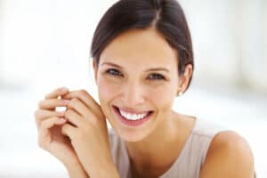 Stock image of a female model with a beautiful smile, cosmetic dentist charlotte, nc